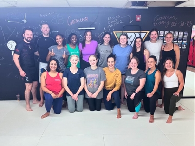 The Women in Emergency Medicine group joins a self defense class. 